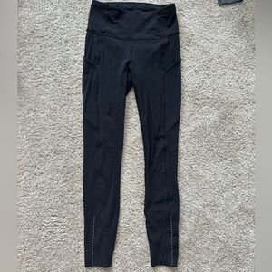 Black lululemon high rise leggings with pockets. Size 4.